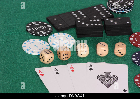 An image showing the concept of risk with four aces some dice and dominos Stock Photo