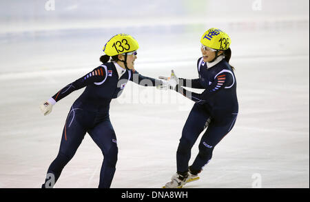 Trentino, Italy. 20th Dec, 2013. South Korea's Lee Eunbyul (L) and Song Jaewon celebrate after the women's short track 3,000m relay final at the 26th Winter Universiade in Trentino, Italy, Dec. 20, 2013. South Korea claimed the title with 4 minutes and 15.946 seconds. Credit:  Bai Xuefei/Xinhua/Alamy Live News Stock Photo