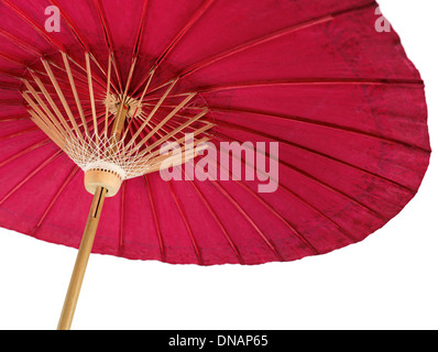 Red oriental paper umbrella, Japanese parasol isolated on white background Stock Photo