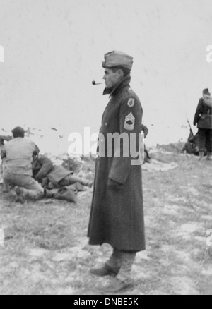 Soldier in Long Coat Smoking Pipe, Portrait, WWII, HQ 2nd Battalion, 389th Infantry, US Army military base, Indiana, USA, 1942 Stock Photo