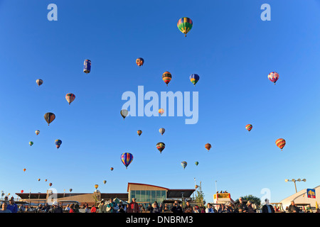 Spectators below hot air balloons in flight, Albuquerque International Balloon Fiesta, Albuquerque, New Mexico USA Stock Photo