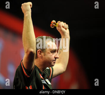 London, UK. 21st Dec, 2013. Richie Burnett [Wales] celebrates in his game against Andy Hamilton [England] during the second round match at The Ladbrokes World Darts Championships from Alexandra Palace. Richie Burnett won the match. Credit:  Action Plus Sports/Alamy Live News Stock Photo