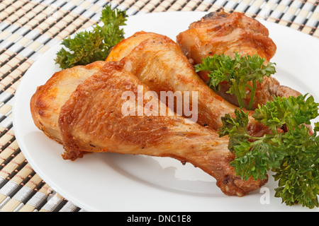 Grilled chicken legs served with parsley Stock Photo
