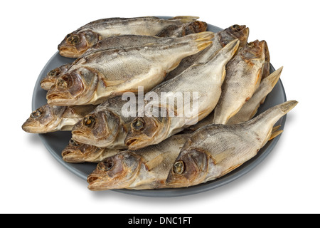 dried river perches on a grey plate Stock Photo