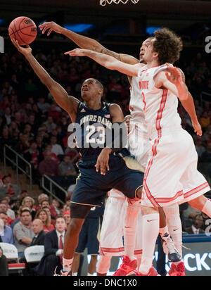 New York, New York, USA. 21st Dec, 2013. Notre Dame's guard Demetrius Jackson (23) shot is blocked by Ohio State's forward LaQuinton Ross (10) in the first half during the BlackRock Gotham Classic between the Notre Dame Fighting Irish and the Ohio State Buckeyes at Madison Square Garden in New York City. Credit:  csm/Alamy Live News Stock Photo