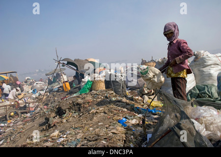 Group of scavengers are collecting recyclable material at the toxic Stung Meanchey Landfill in Phnom Penh, Cambodia. Stock Photo