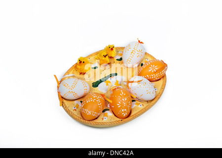 little yellow chickens and colorful eggs celebrates easter Stock Photo