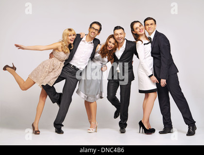 Group of laughing young friends in fancy pose Stock Photo