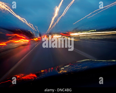 Driving along M4 Motorway in West London UK at dusk Stock Photo