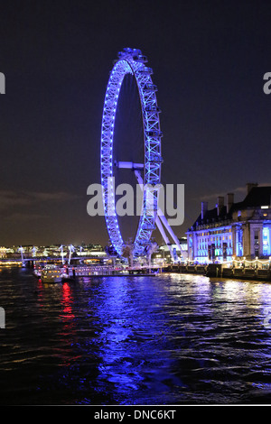 The London Eye lit at night in preparation for Christmas seen from Westminster Bridge Stock Photo
