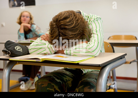 Male student sleeping in the classroom Stock Photo