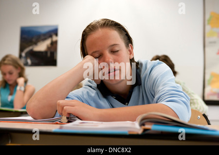 Male student sleeping in the classroom Stock Photo
