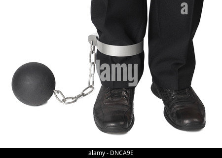 Businessman with ball and chain on his leg on white background. Stock Photo
