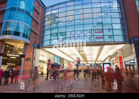 Manchester, UK. 22nd December, 2013. An external shot of Manchester Arndale shopping centre and Market Street during the Christmas lead up period. Market Street is one of the busiest commercial thoroughfares in the city. Credit:  Russell Hart/Alamy Live News Stock Photo