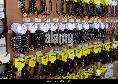 Buddhist prayer beads (mala) on sale at temple store - South Korea Stock Photo