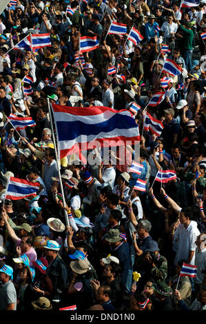 Bangkok. 22nd Dec, 2013. Tens of thousands of anti-government protesters wave Thai flags and block the intersection of Asok & Sukhumvit roads in a blatant display of nationalism. Hundreds of thousands of protesters took to the streets to demand the resignation of Thai Prime Minister Yingluck Shinawatra. Credit:  Kraig Lieb / Alamy Live News Stock Photo