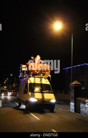 Wales, UK 22 December 2013  Father Christmas visiting the village of Deiniolen, North Wales Credit:  Gari Wyn Williams/Alamy Live News Stock Photo