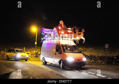 Wales, UK 22 December 2013  Father Christmas visiting the village of Deiniolen, North Wales Credit:  Gari Wyn Williams/Alamy Live News Stock Photo