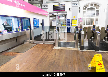 Southend-On-Sea. 24th Dec, 2013. Southend Central train station ticket hall deserted with no trains to London and only one train is scheduled to leave to Shoeburyness, after the storm. Southend-on-sea, Essex, England.The stormy weather has caused disruption across the UK. Credit:  graham whitby boot/Alamy Live News Stock Photo