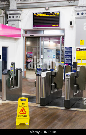 Southend-On-Sea. 24th Dec, 2013. Southend Central train station ticket hall deserted with no trains to London and only one train is scheduled to leave to Shoeburyness, after the storm. Southend-on-sea, Essex, England.The stormy weather has caused disruption across the UK. Credit:  graham whitby boot/Alamy Live News Stock Photo