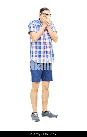 Full length portrait of a frightened young man looking Stock Photo