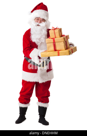 Santa Claus carrying sack of gifts Stock Photo