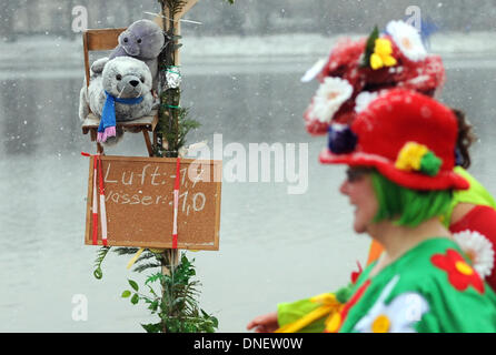 FILE - A file photo dated 01 December 2013 shows a air and water temperature sign next to a person wearing a colorful costume during the ice swimming session in Berlin, Germany, 12 January 2013. 17 associations take part in the traditional ice swimming session in the freezing temperatures. Photo: Britta Pedersen/dpa Stock Photo