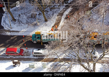 Toronto, Canada. 24th Dec, 2013. Toronto Hydro workers and vehicles busy at restoring electricity supply on Balliol Street, midtown Toronto, after ice storm and freezing rain on December 22, 2013 Credit:  CharlineXia/Alamy Live News Stock Photo