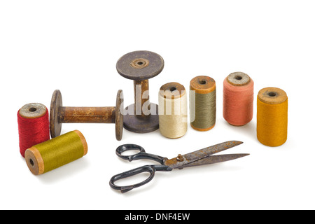 Scissors and spools isolated on white background Stock Photo