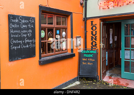 Signs for live music and menu outside bar and restaurant, Corofin, Co. Clare, Ireland Stock Photo