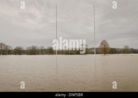 Flooded playing fields footpath in flood plane at Tonbridge School as river Medway floods floodplain Stock Photo