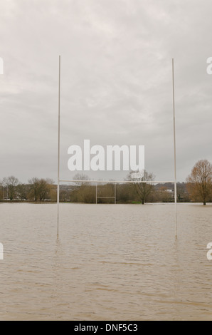 Flooded playing fields footpath in flood plane at Tonbridge School as river Medway floods floodplain Stock Photo