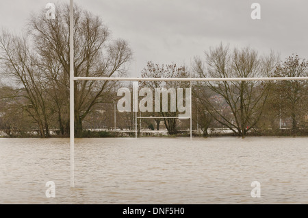 Flooded playing fields footpath in flood plane at Tonbridge School as river Medway floods floodplain Stock Photo