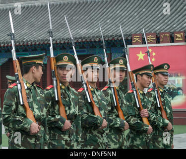 Oct. 26, 2006 - Beijing, Beijing Municipality, People's Republic of China - Camouflage uniformed members of the People's Armed Police Force (CAPF) perform drills with bayoneted rifles at their barracks in the courtyard of the Forbidden City outside the Meridian Gate in Beijing. A paramilitary force mainly dealing with civilian order, they guard government buildings, provide protection to senior government officials, provide security functions at public events and respond to riots, terrorist attacks or other emergencies. (Credit Image: © Arnold Drapkin/ZUMAPRESS.com) Stock Photo