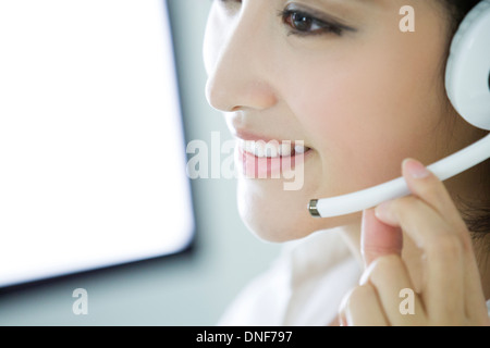 Female call service representative at work Stock Photo