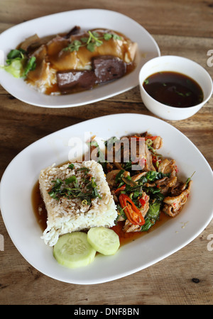Fried pork with sweet basil and white jasmine sticky rice and Rice with roast duck Stock Photo