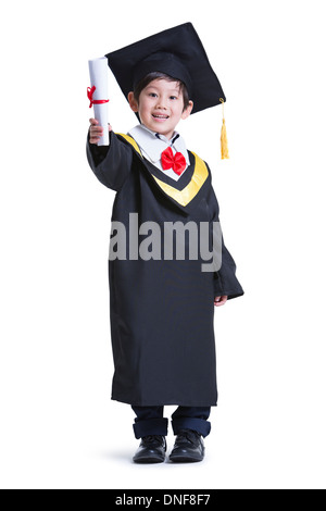 Cute boy in graduation gown Stock Photo