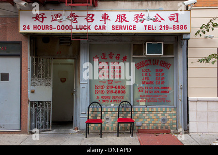 Storefront of Good Luck Car Service, typical Chinese business in Chinatown, Lower East Side, Manhattan, New York, NY, USA. Stock Photo