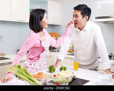 asian couple in kitchen