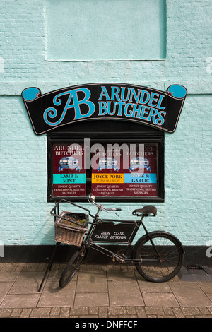 Traditional meat delivery bicycle parked outside Arundel butchers shop outside Arundel butchers shop Arundel West Sussex UK Stock Photo