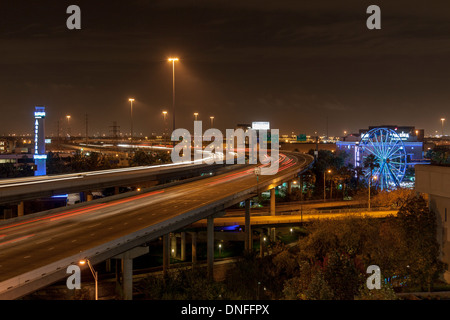 Streaking car lights at night on Interstate 45 in downtown Houston Stock Photo