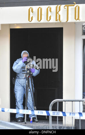 Shaftesbury Avenue, London, UK. 26th Dec, 2013. Scene of crime officers outside the Avalon club in Shaftesbury Avenue, London, where a man was shot. The man later died in hospital. Credit:  Matthew Chattle/Alamy Live News. Stock Photo