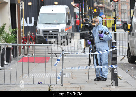 Shaftesbury Avenue, London, UK. 26th Dec, 2013. Scene of crime officers outside the Avalon club in Shaftesbury Avenue, London, where a man was shot. The man later died in hospital. Credit:  Matthew Chattle/Alamy Live News. Stock Photo