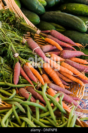 Cucumbers, carrots & string beans for sale, Buena Vista, Colorado, Farmer's Market Stock Photo