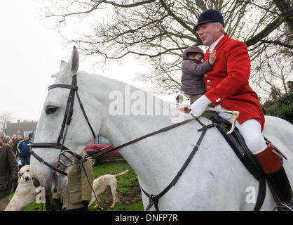 Oakham, Rutland, UK. 26th Dec, 2013. Huntsman Andrew Osborne gives a ride to a young supporter during the Cottesmore Hunt's Boxing Day meet. Credit:  Nico Morgan/Alamy Live News Stock Photo