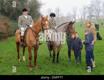 Oakham, Rutland, UK. 26th Dec, 2013. Grandfather and grandson Michael Stokes and Ned Forryan at the Cottesmore Hunt's traditional Boxing Day meet. Credit:  Nico Morgan/Alamy Live News Stock Photo