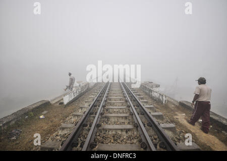 Agartala, Tripura, India. 22nd Dec, 2013. Indian man performs stretch exercises on a foggy morning in Agartala, capital of the North Eastern state of Tripura, India. Dense fog threw air and rail traffic out of gear in north India today, according to a news agency. It has stopped normal Life.Photo: Abhisek Saha/NurPhoto Credit:  Abhisek Saha/NurPhoto/ZUMAPRESS.com/Alamy Live News Stock Photo