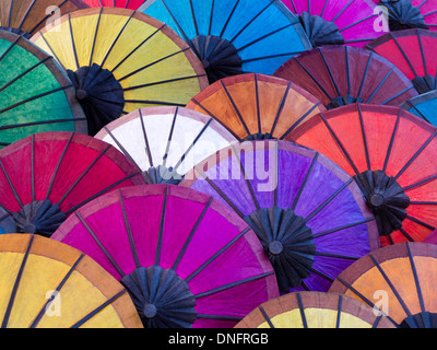 Colorful umbrellas on display at street market in Luang Prabang, Laos. Stock Photo
