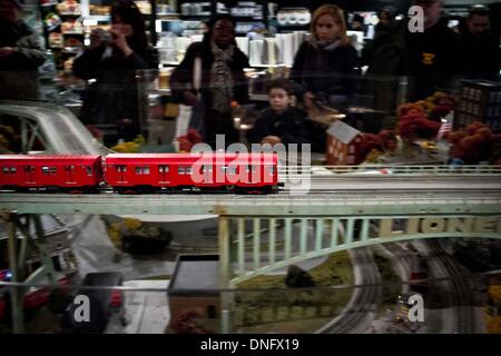 New York. 26th Dec, 2013. Tourists look at model trains on display during the 12th Annual New York Transit Museum Holiday Train Show at Grand Central Terminal in New York, on Dec. 26, 2013. The exhibition runs from Nov. 16 to Feb. 23 next year. Credit:  Niu Xiaolei/Xinhua/Alamy Live News Stock Photo