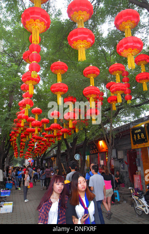 Beijing China,Chinese,Dongcheng District,Nanluoguxiang,hutong,shopping shopper shoppers shop shops market markets marketplace buying selling,retail st Stock Photo